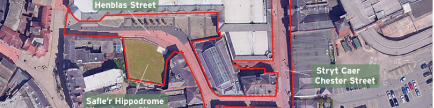 Aerial map of Wrexham City centre highlighting a red-outlined development area spanning Henblas Street, Chester Street, and the Hippodrome site with surrounding buildings and a central green space.