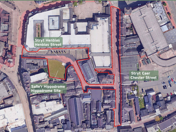 Aerial map of Wrexham City centre highlighting a red-outlined development area spanning Henblas Street, Chester Street, and the Hippodrome site with surrounding buildings and a central green space.