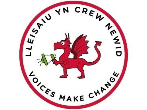 Picture of a red dragon with a loud speaker, the words say voices make change